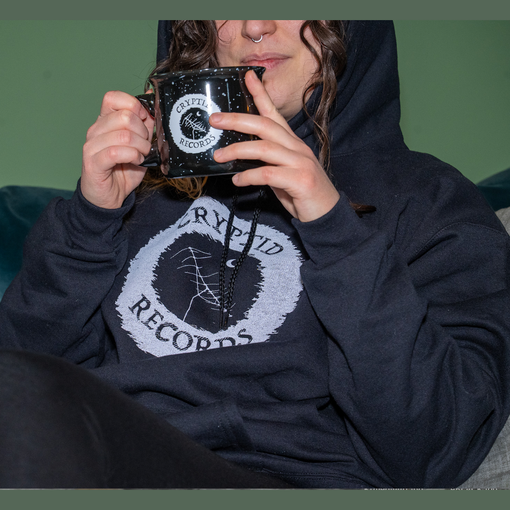 Model wearing The Beacon (Antenna) hoodie in black from Cryptid Records