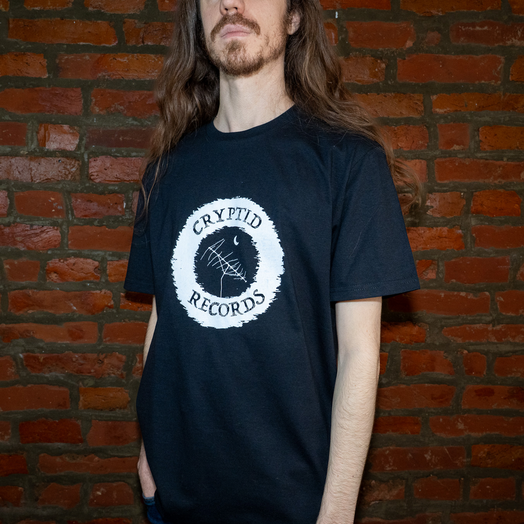Model wearing The Beacon Antenna Cryptid Records graphic t-shirt