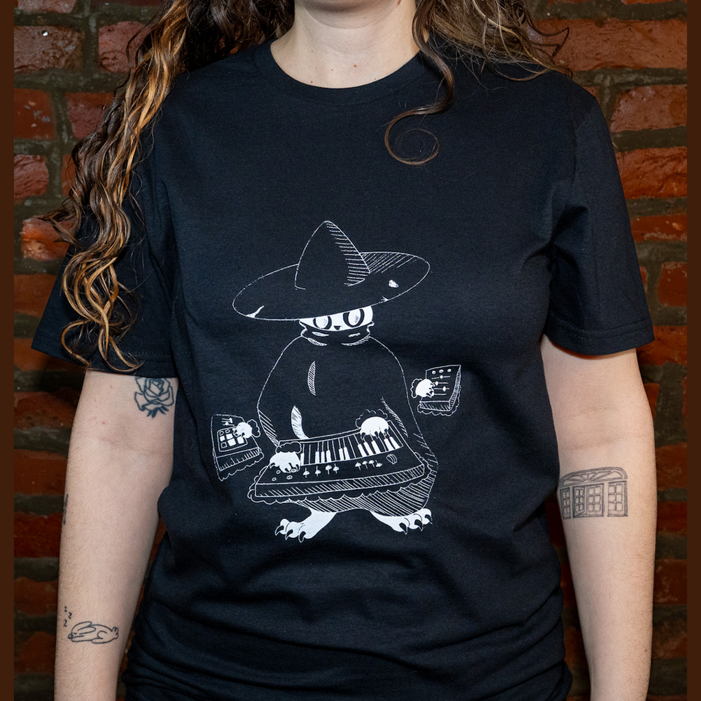 Model wearing Maestro (keys wizard) graphic t-shirt from Cryptid Records in black