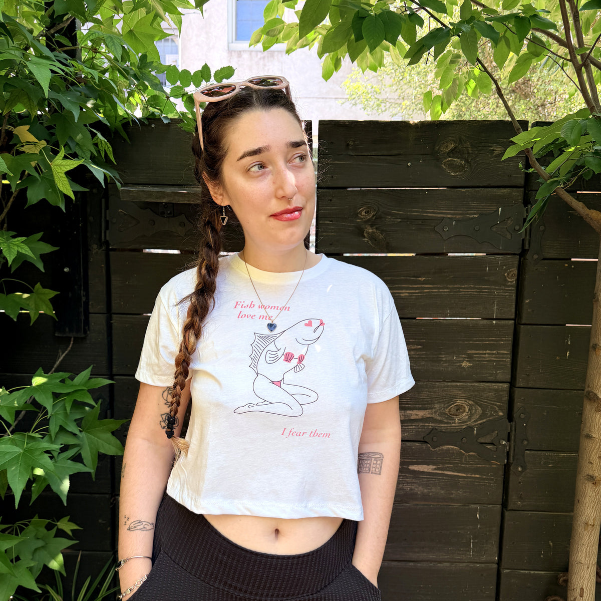 Model wearing the Sirena Fish Woman crop top in white from Cryptid Records